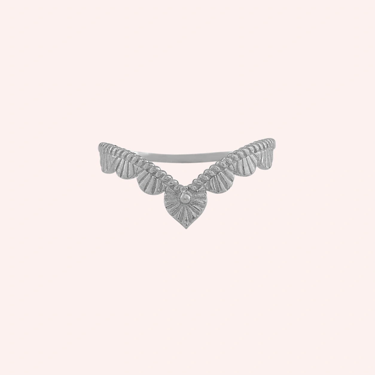 Wishbone_ring_in_sterling_silver_with_designed_v_shape_in_front_angle_view_on_solid_pink_background